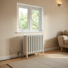 Oil filled radiator heater in a bright living room near a window for steady, quiet warmth