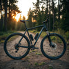 21-speed mountain bike with visible gears and front suspension on a forest trail