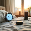 Sleek smart alarm clock glowing on a bedside table near a smart speaker at dawn