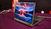 Modern laptop displaying a vibrant landscape on screen.