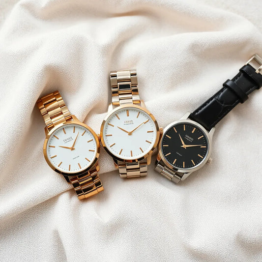 Assorted women’s fashion watches with mixed metal and leather bands displayed in soft daylight