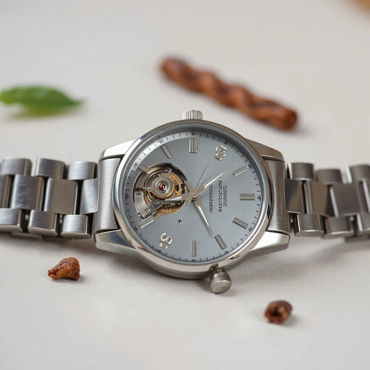 Quartz wristwatch with detailed dial and polished metal case on a neutral background