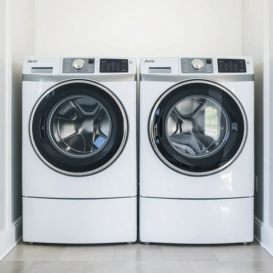 Two modern washing machines in a bright, clean laundry room with visible glass doors