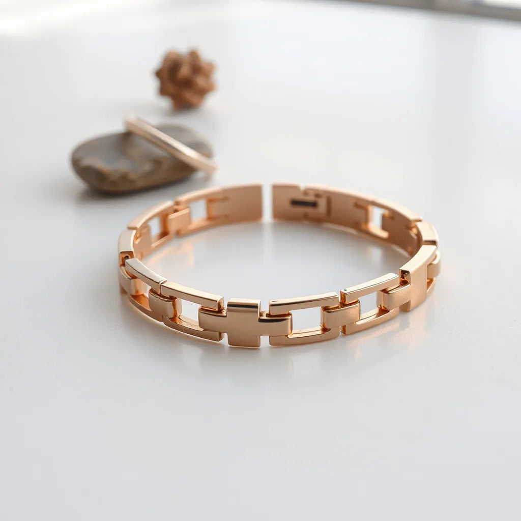 Rose gold stainless steel band bracelet with visible links and soft reflections on a neutral background