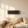 Modern heater showing three heat levels in a cozy living room with warm lighting