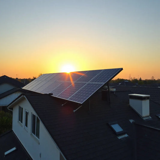 Residential rooftop with high-efficiency solar panels generating power in clear golden-hour light