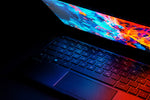 black laptop computer turned on displaying desktop