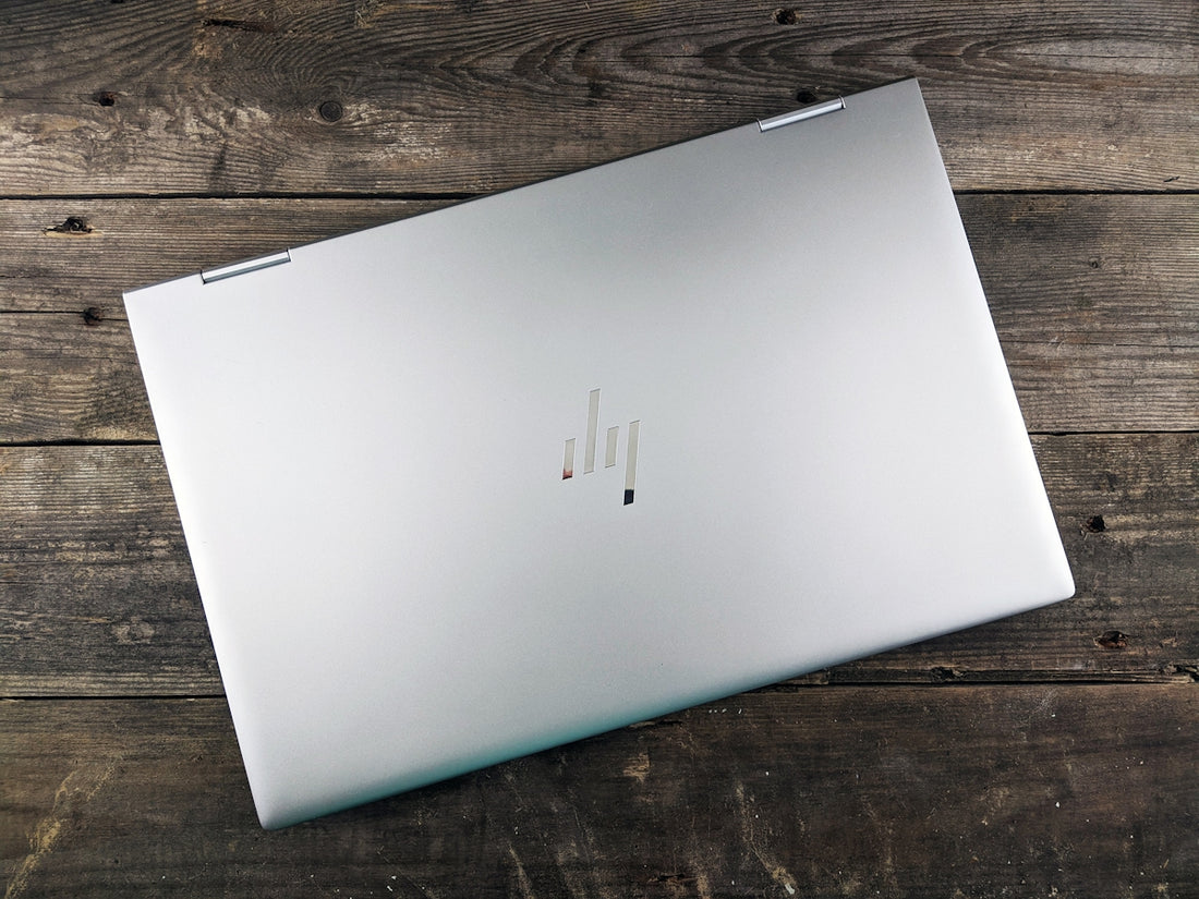 a white rectangular device on a wooden surface
