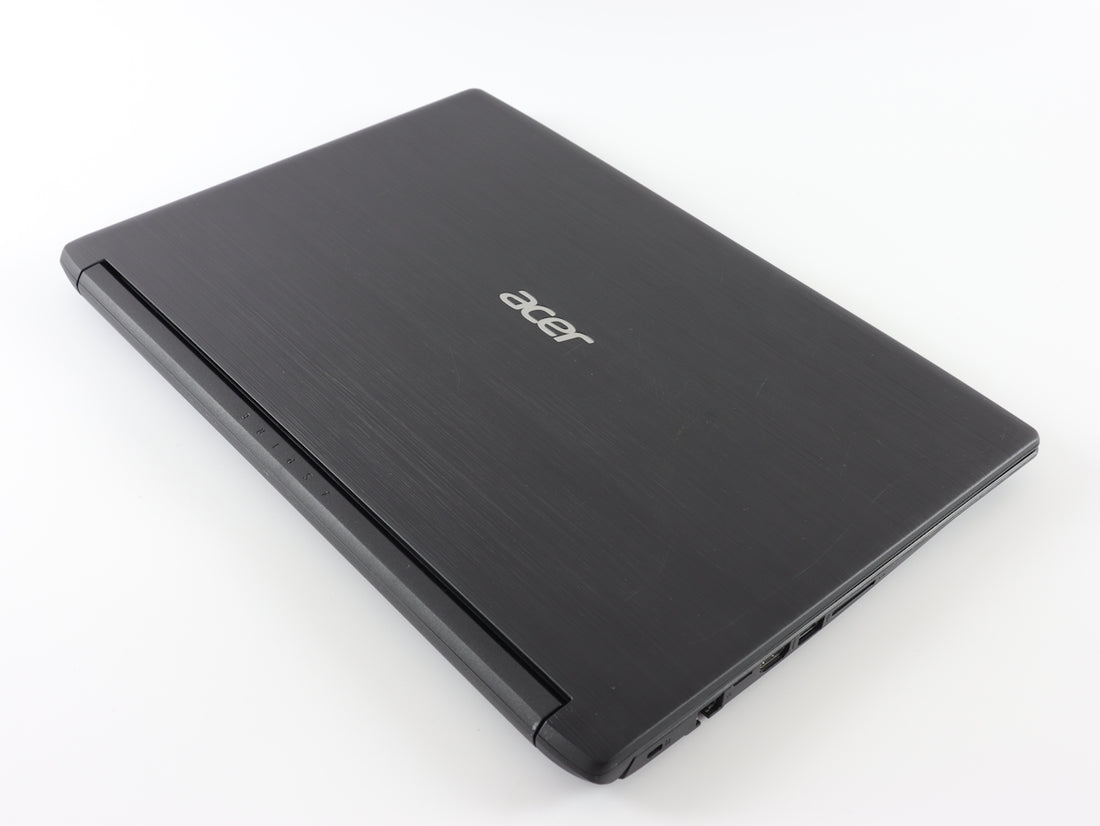 a laptop computer sitting on top of a white table