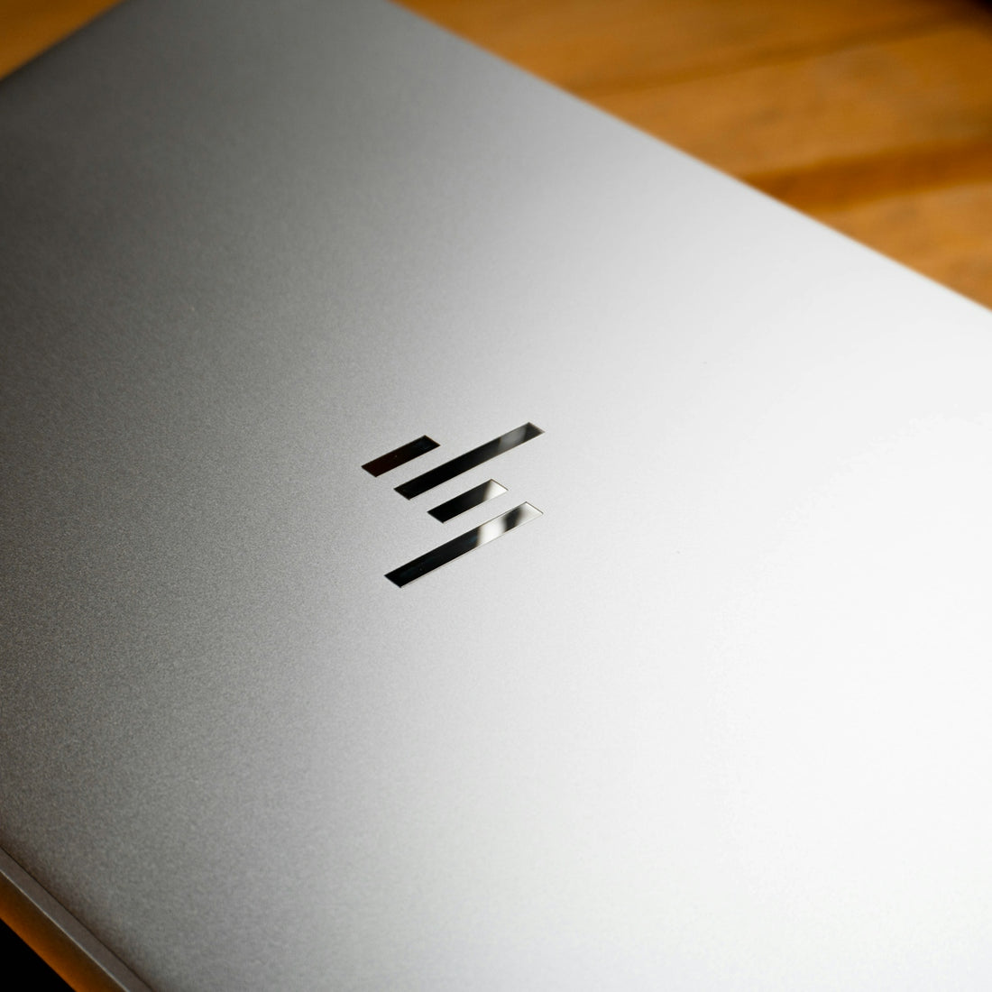 A close up of a laptop on a wooden table