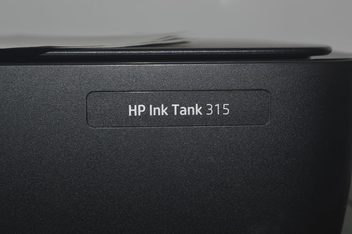 A close up of a hp ink tank
