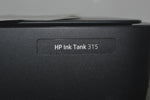 A close up of a hp ink tank