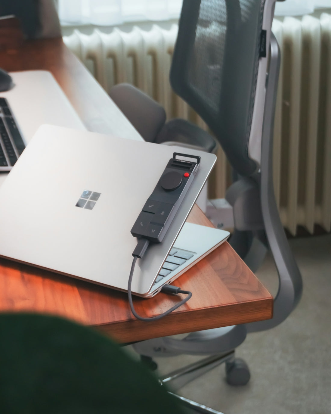 A laptop with a presentation remote.