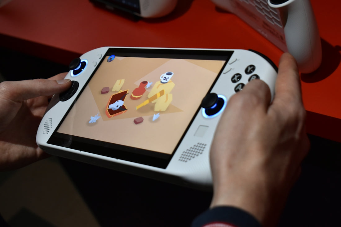 Person playing a handheld gaming device with colorful screen