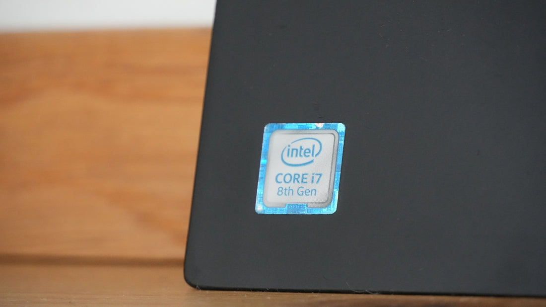 Intel core i7 sticker on a dark surface.