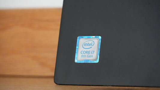 Intel core i7 sticker on a dark surface.