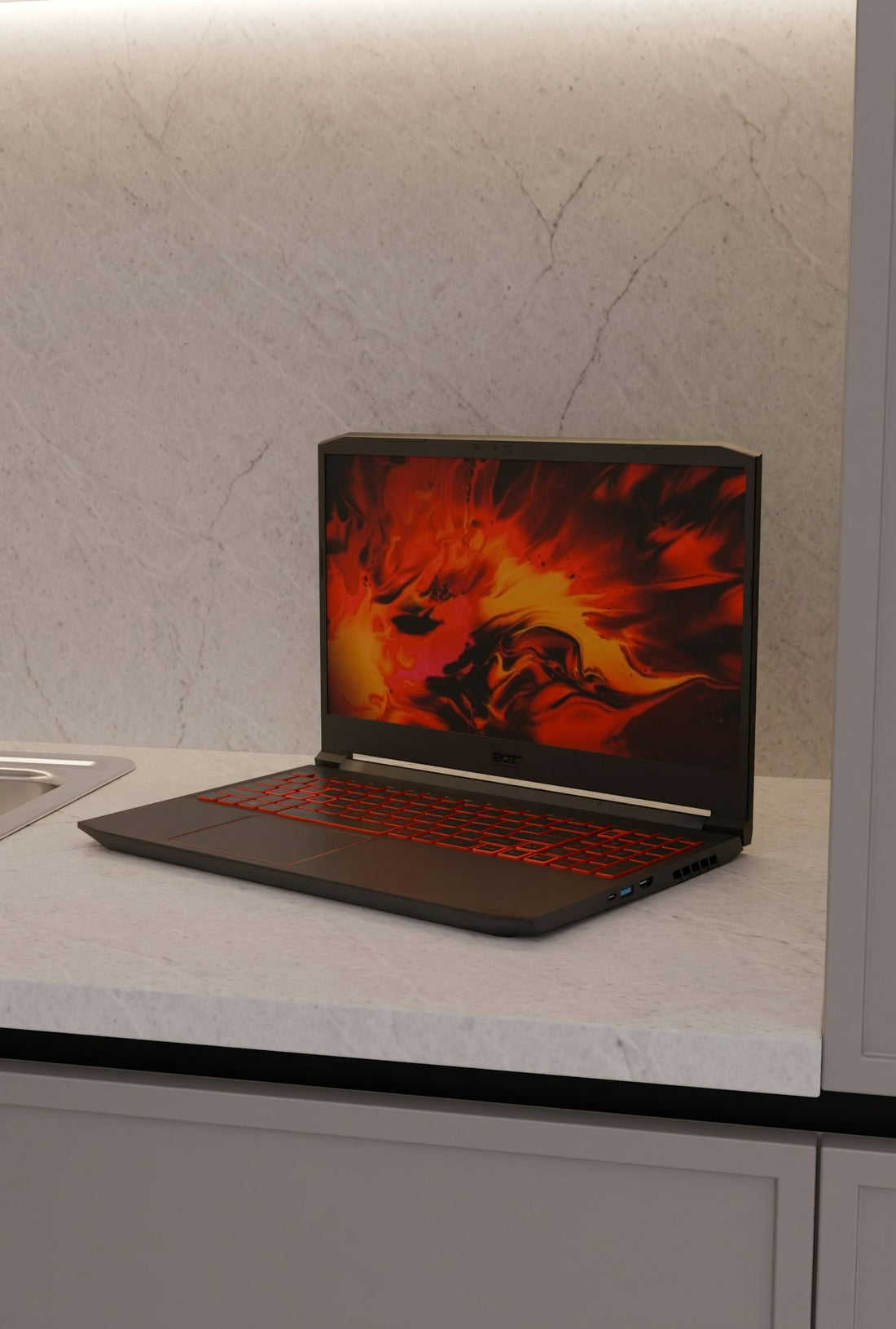 A black laptop with a fiery screen on a countertop