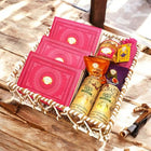 Ghasitaram Gifts Jaiccha Holi- Sweets/Holi Hampers/Thandai Brown Cane Basket of Gujiyas, Sweets/Bites, Namkeen, Thandai and Organic Gulal 