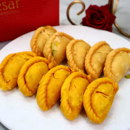 Jaipur Ace Holi Celebration Set - Herbal Gulal, Delicious Gujia Sweets, and a Copper Dryfruit Jar filled with Cashew and Almonds!"(Includes 2 holi colour,10 assorted Gujia,2 Dryfruit) 