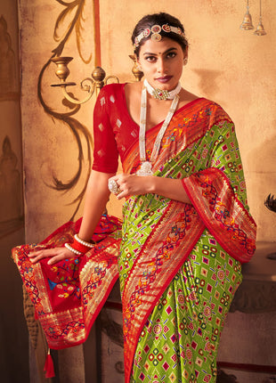 AKHILAM Women's Soft Patola Silk Ikat Print Golden Zari Border Saree With Unstitched Blouse Piece (Green_SMNGLM1002_SS) 