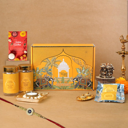 Oriole Gifts Rakhi Hamper for Brother with Premium Evil Eye Rakhi, Chocolate Bites, Almond Brittles, Coffee Almond Nutties, Paan Shots, Snacks & Greeting Card | Rakshabandhan Gift for Brother with Chocolate Gift Box 