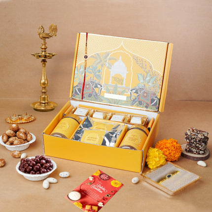 Oriole Gifts Rakhi Hamper for Brother with Premium Evil Eye Rakhi, Chocolate Bites, Almond Brittles, Coffee Almond Nutties, Paan Shots, Snacks & Greeting Card | Rakshabandhan Gift for Brother with Chocolate Gift Box 