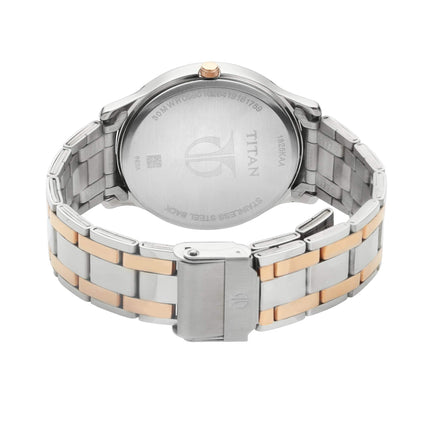 Titan Gents Karishma analog blue-dial watch with two-tone rose-gold and silver stainless steel bracelet.