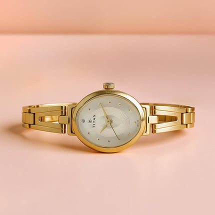 Titan Karishma Revive Analog Champagne Dial Women's Watch-NM2594YM01 / NL2594YM01 